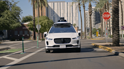 Waymo Jaguar I-PACE driving fully autonomously through Downtown Phoenix