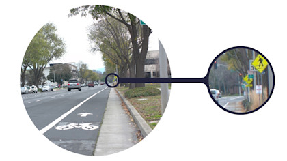 A photo from the Waymo Driver's cameras with a magnifying glass illustrating how it can perceive at long distances