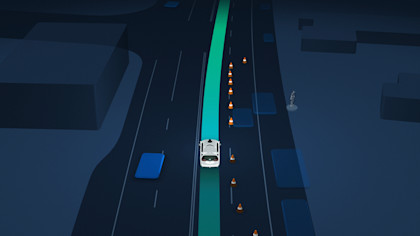 Waymo One in-car display: vehicle nudging around cones