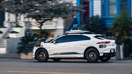 A photo of a Waymo I-PACE with the 5th-generation Driver in San Francisco