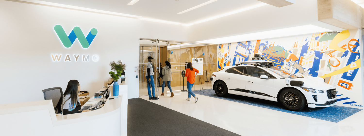 Car, Car Dealership, Person, Chair, Shoe, Alloy Wheel, Spoke, Indoors, Hat, Interior Design